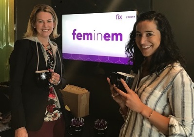 Two women visit at an event